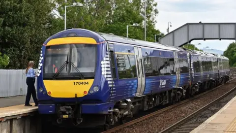 Getty Images ScotRail train sitting at platform in train station