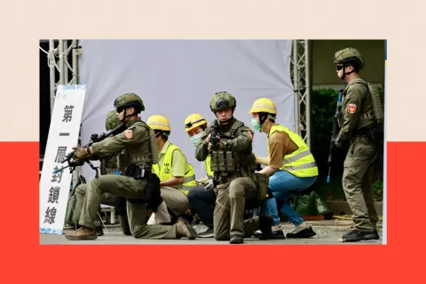 Ritchie B Tongo/ EPA/Shutterstock Rescuers and volunteers secure a telecommunication facility as they participate in the Urban Resilience Exercise after the air raid drill, as part of the annual Han Kuang military exercises, in Taipei, Taiwan