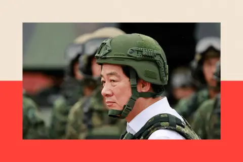 Ritchie B Tongo / EPA/Shutterstock Taiwanese President William Lai in army gear, including a green helmet
