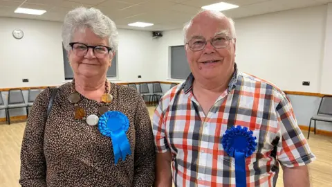 Judy Couch stood with Phillip Owen
