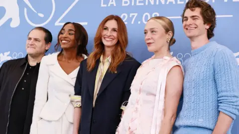Getty Images Michael Stuhlbarg, Ayo Edebiri, Julia Roberts, Chloë Sevigny and Andrew Garfield attend the "After The Hunt" photocall during the 82nd Venice International Film Festival on August 29, 2025 in Venice, Italy