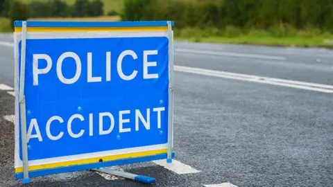 Getty Images Blue police accident sign