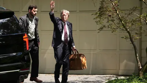 Getty Images Bolton returns home after a raid