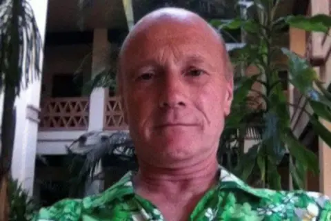 Jon Ruben/Facebook A selfie taken by Jon Ruben, wearing a green shirt and staring down