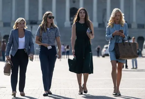 AFP via Getty Images Teresa Helm (2nd R), an abuse victim of Jeffery Epstein, walks with a group of women after they spoke behind closed doors with the House Oversight Committee