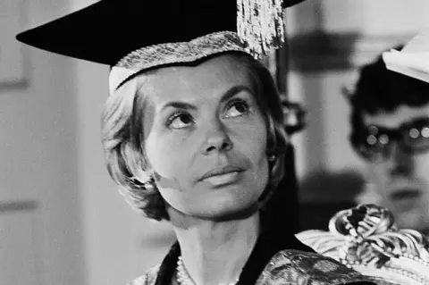 Getty Images A black and white photo of The Duchess of Kent in early adulthood. She is wearing a mortar board and looking off camera.