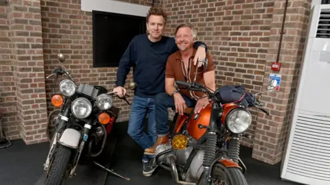 Getty/Dave Bennett Actor Ewan McGregor and TV presenter Charley Boorman with two motorbikes