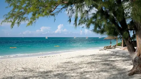 Getty Images A beach on Providenciales island, which is the most populated in Turks and Caicos