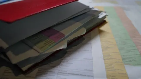 Anahita Sachdev/BBC Anjali's folder where she has compiled a list of documents to track down her money following the digital arrest.
