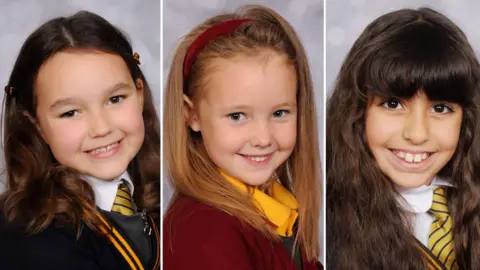 Family photos A composite image of  Bebe King, Elsie Dot Stancombe and Alice Aguiar all in their school uniforms and smiling. 