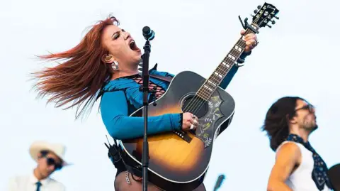 Getty Images CMAT on stage at the All Points East festival