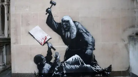 PA Media Mural of a judge attacking an apparent protestor with a gavel.