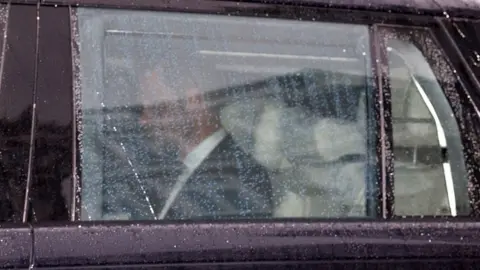 TOBY SHEPHEARD/AFP via Getty Images Duke of Sussex leaves Clarence House in London on 10 September in back of car after his meeting with King Charles