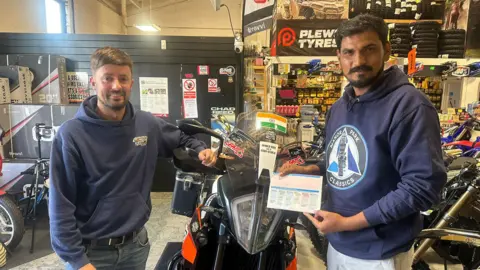 Ben Ledwidge and Yogesh Alekari with the new bike