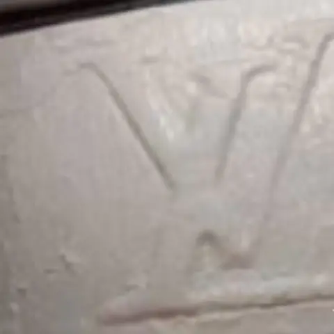 Gwent Police A police picture of a slab of white drugs - cocaine - with an LV logo on it