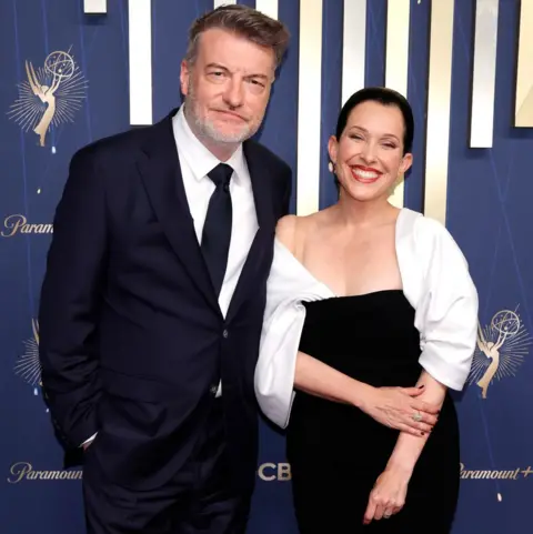 Getty Images Charlie Brooker and Jessica Rhoades attend the 77th Primetime Emmy Awards at Peacock Theater on September 14, 2025 in Los Angeles, California