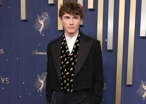Getty Images Sam Nivola attends the 77th Primetime Emmy Awards at Peacock Theater on September 14, 2025 in Los Angeles, California