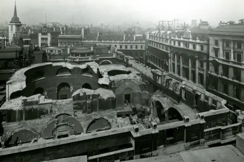 Bank of England Museum Black and white aerial photo of parts of original bank demolished with roofs missing from the building