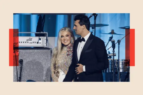 Samuel Corum/Getty Images Charlie Kirk and and his wife Erika Lane Frantzve on stage