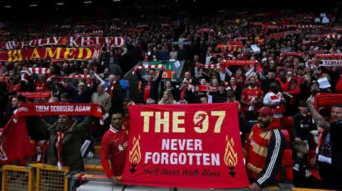 Getty Images Liverpool's supporters hold banners reading messages paying a tribute to the victims of the Hillsborough disaster at the start of the English Premier League football match between Liverpool and West Ham United at Anfield in Liverpool, north west England on April 13, 2025.