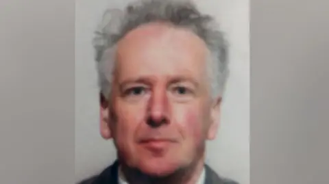 Police Scotland Ian Ross is an older man with grey hair. He is wearing a jacket over a white shirt and is pictured against a neutral background.